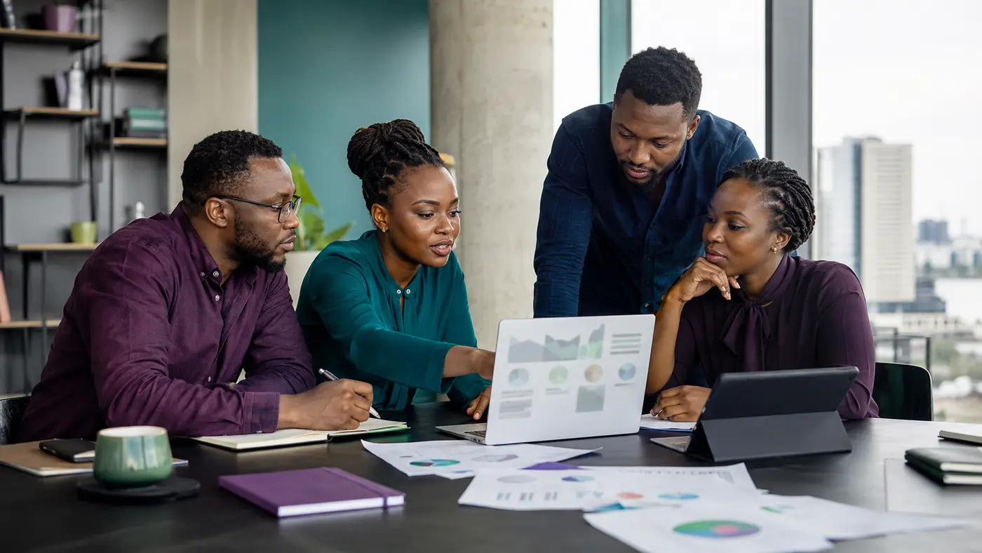 A multidisciplinary African research and analytics team reviewing evidence together
